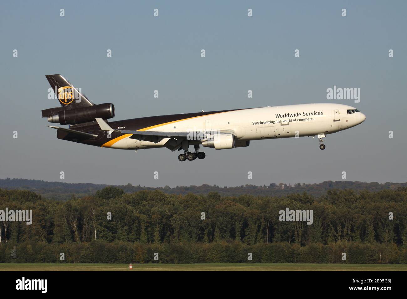 UPS McDonnell Douglas MD-11F with registration N283UP on short final for runway 14L of Cologne Bonn Airport. Stock Photo
