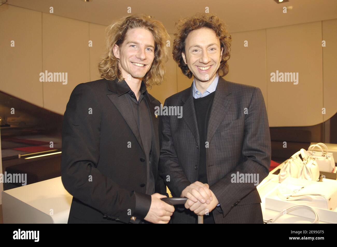 French former olympic champion Gwendal Peizerat and French TV presenter  Stephane Bern attend the Lancel store opening party on the Champs Elysees,  in Paris, France, on January 26, 2006. Photo by Nicolas