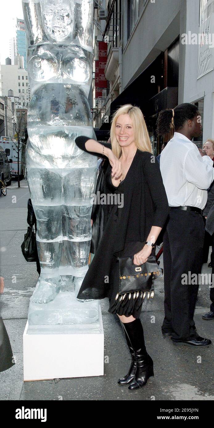 A pregnant Mira Sorvino poses by an ice sculpture of a pregnant woman as she opens the new Destination Maternity store on the corner of Madison and 57th street in New York, on Wednesday, February 1, 2006. Photo by Nicolas Khayat/ABACAPRESS.COM. Stock Photo