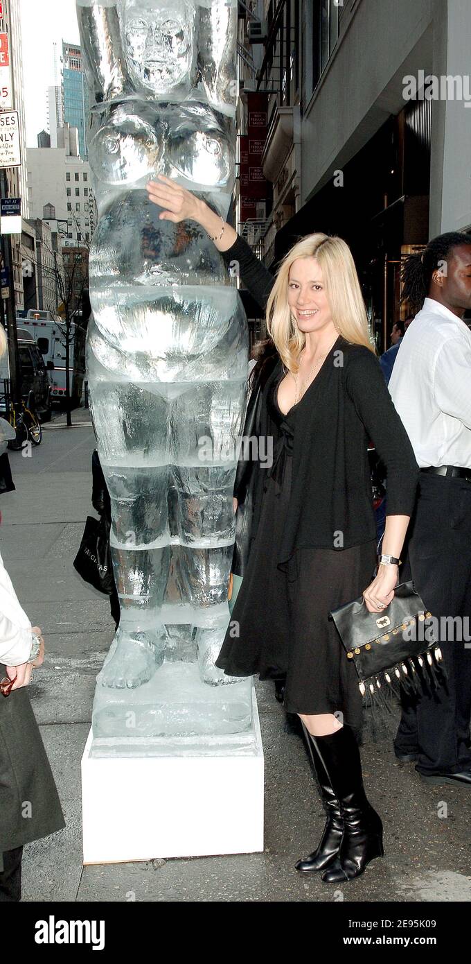 A pregnant Mira Sorvino poses by an ice sculpture of a pregnant woman as she opens the new Destination Maternity store on the corner of Madison and 57th street in New York, on Wednesday, February 1, 2006. Photo by Nicolas Khayat/ABACAPRESS.COM. Stock Photo