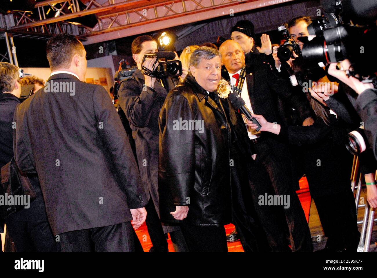 US actor Jerry Lewis poses upon his arrival on the red carpet prior to the  annual ""Goldene Kamera"" awarding ceremony organized by German TV magazine  Hoerzu in the Ullstein Halle at the