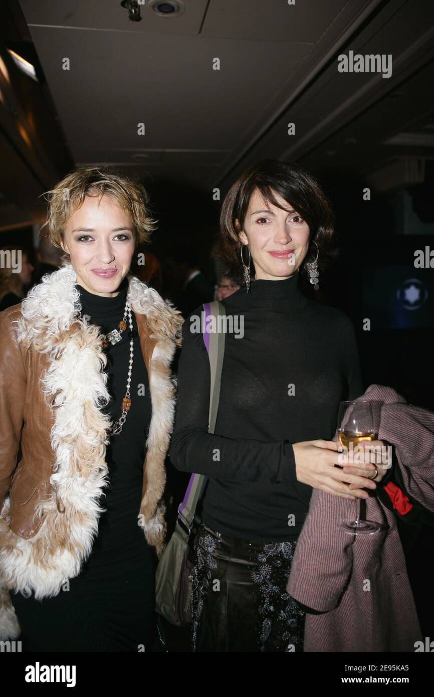 Milla Jovovich and Helene Arnault attending the Louis Vuitton Fall-Winter  2009-2010 ready-to-wear collection show by Designer Marc Jacobs in Paris,  France on March 12, 2009. Photo by Thierry Orban/ABACAPRESS.COM Stock Photo  