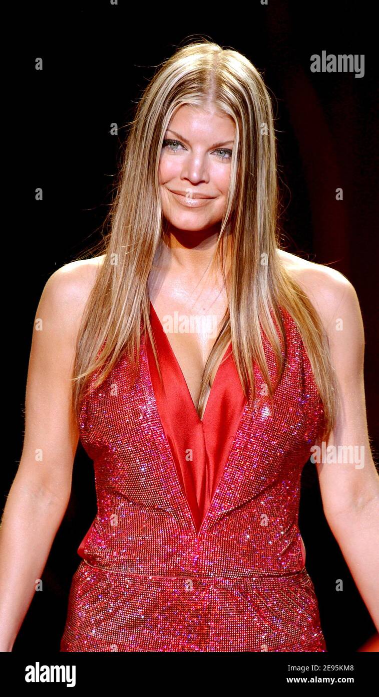 Fergie of the Black Eyed Peas walks the runway at the Heart Truth Red Dress  (for Women's heart disease charity) show during the Fall - Winter 2006  Olympus Fashion Week in New, image size:757x1390