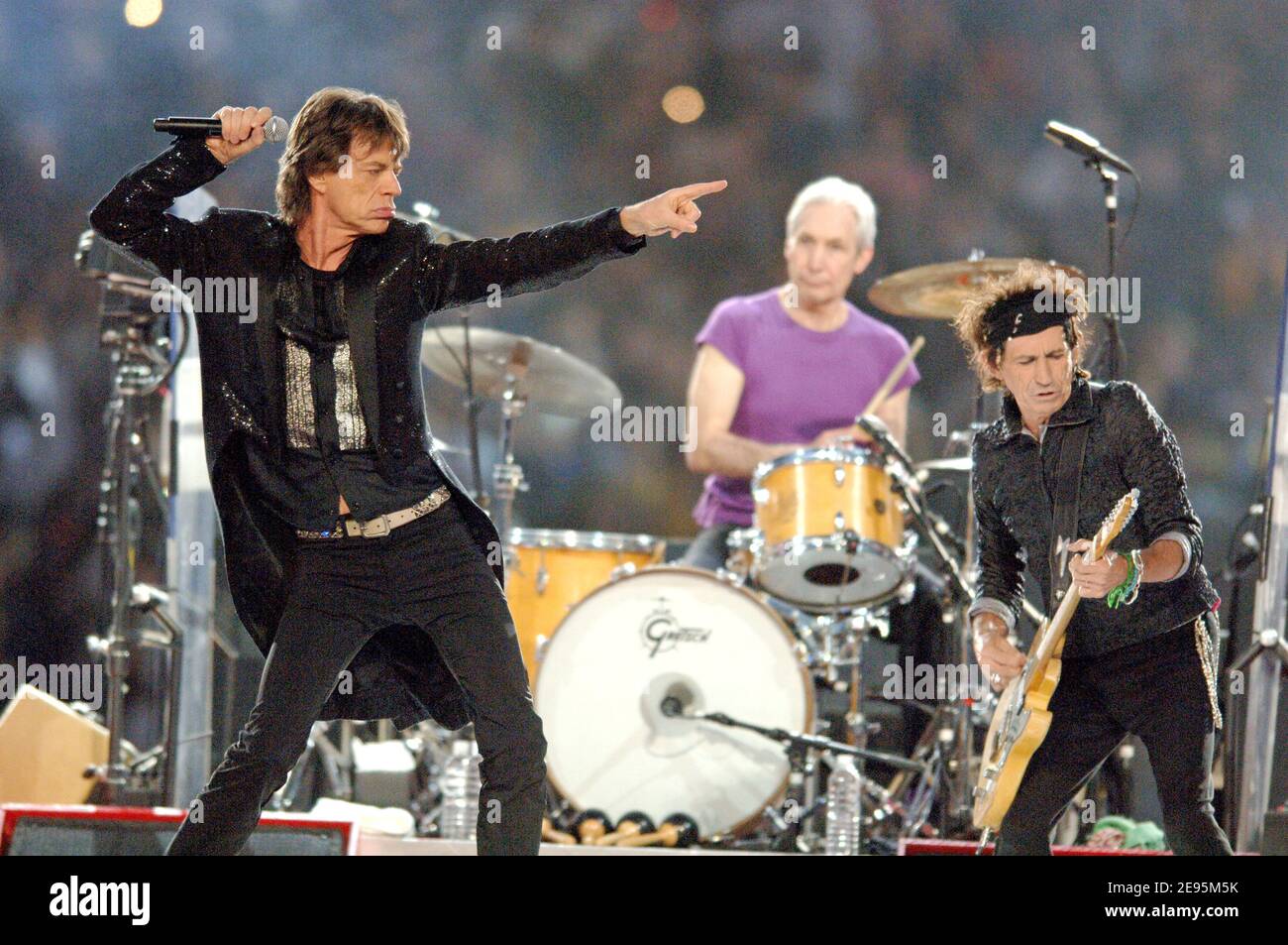 Mick Jagger, Charlie Watts and Keith Richards of The Rolling Stones perform  live on a special stage built on the field during the Super Bowl XL  Half-Time Show in Detroit, MI, USA