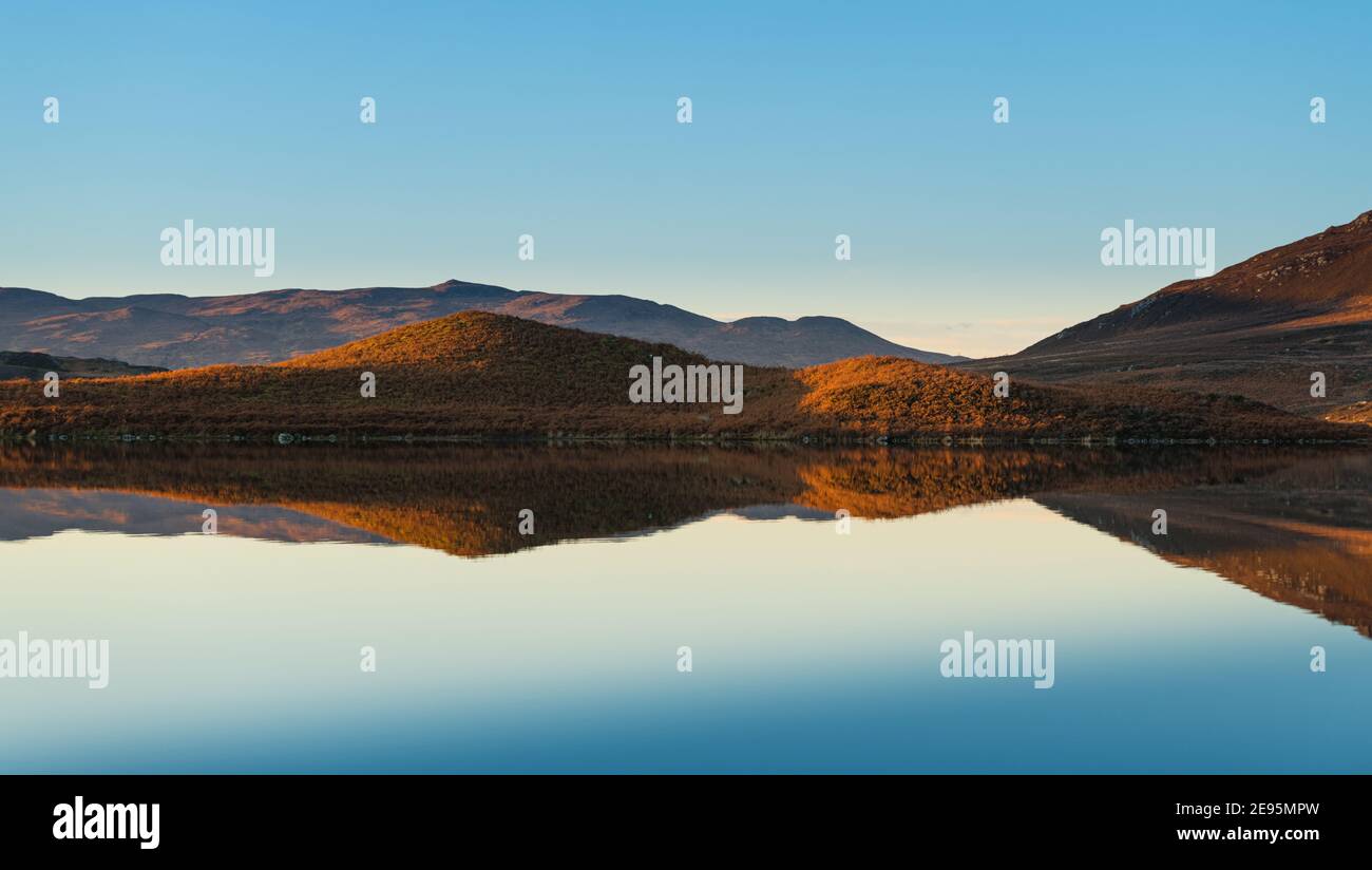 Loch Tarff with reflections at sunset Stock Photo
