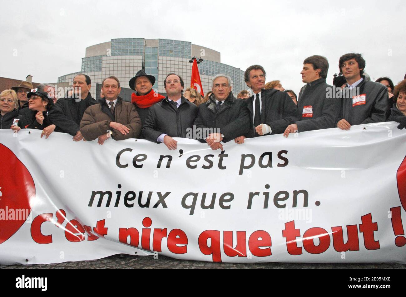 Striking French student and teachers protest with union banners as they demonstrate to demand 'CPE' work contract remove in Paris, France, on February 7, 2006. Trade union federations called for workers and students in France to strike and stage protest marches to demand the suppression of the new work contract reserved for first job called 'CPE'. Pictured here are (l to r) Paris'Mayor Bertrand Delanoe, former Prime minister Laurent Fabius, General Secretary of the French Socialist Party Francois Hollande, Dominique Strauss-Kahn and Jack Lang, former ministers and key members of French Sociali Stock Photo