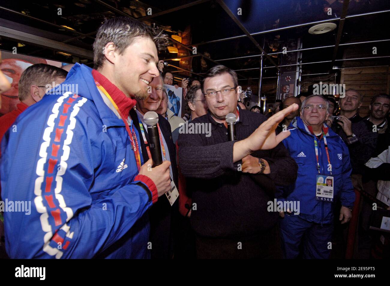 France's Antoine Deneriaz celebrates his gold medal of the Men's downhill at the XX Olympic Winter Games, with French Sports minister Jean-Francois Lamour in Sestrieres, Italy, on February 12, 2006. Photo by Gouhier-Nebinbger-Orban/CAMELEON/ABACAPRESS.COM Stock Photo