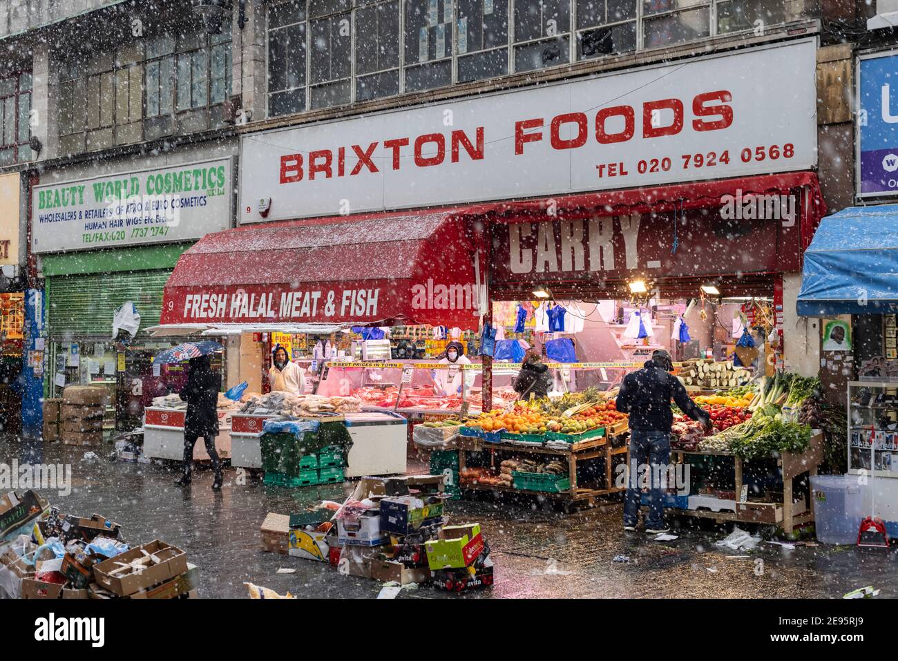 The market on Electric Avenue during heavy snow, Brixton, London, 24