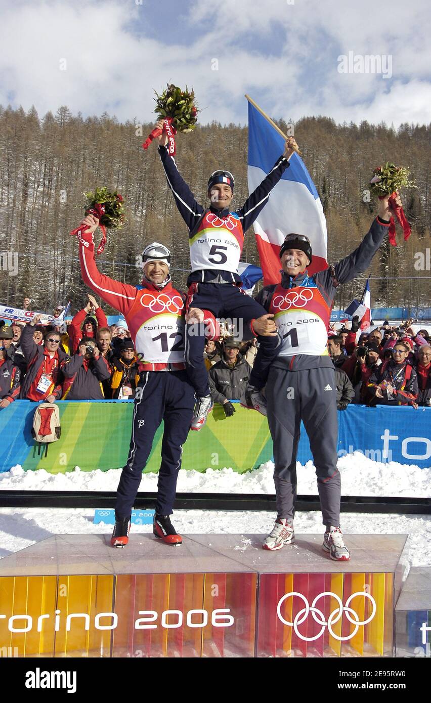 (L-R) Norway's silver medal Ole Einar Bjoerndalen, France's gold medal Vincent Defrasne and Germany's bronze medal Sven Fisher during the podium ceremony at the men's 12,5 km pursuit biathlon event at the Torino 2006 Winter Olympic Games in San Sicario, Italy on February 18, 2006. The XX Olympic Winter Games run from February 10 to February 26, 2006. Photo by Gouhier-Nebinger-Orban/Cameleon/ABACAPRESS.COM Stock Photo