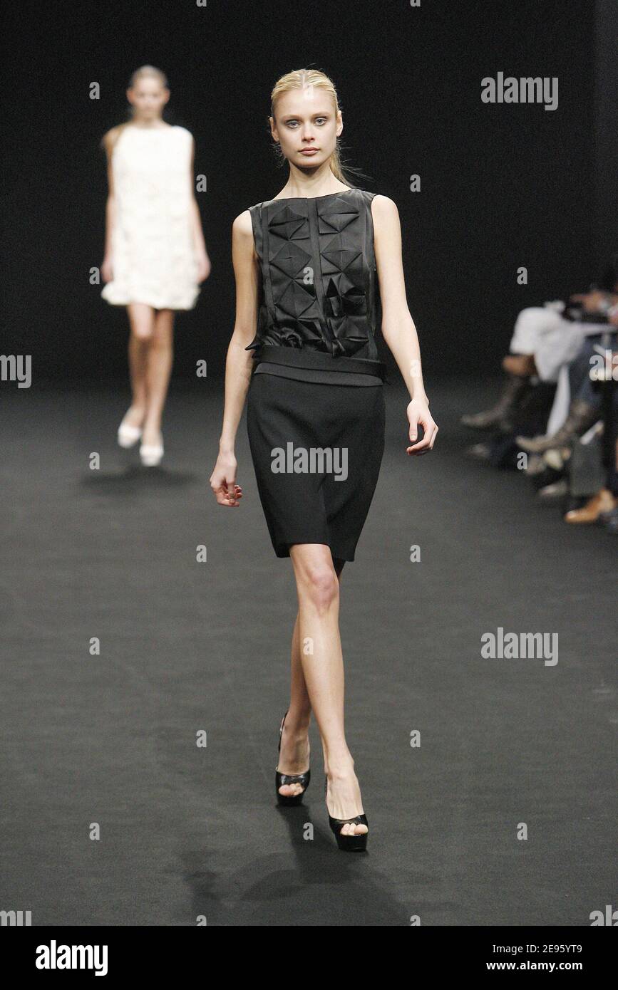 A model parades an outfit of Turkish designer Dice Kayek during her