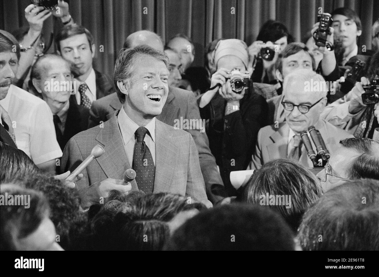 U.S. President Jimmy Carter at Press Conference, surrounded by Journalists, Washington, D.C., USA, Thomas J. O'Halloran, June 13, 1977 Stock Photo