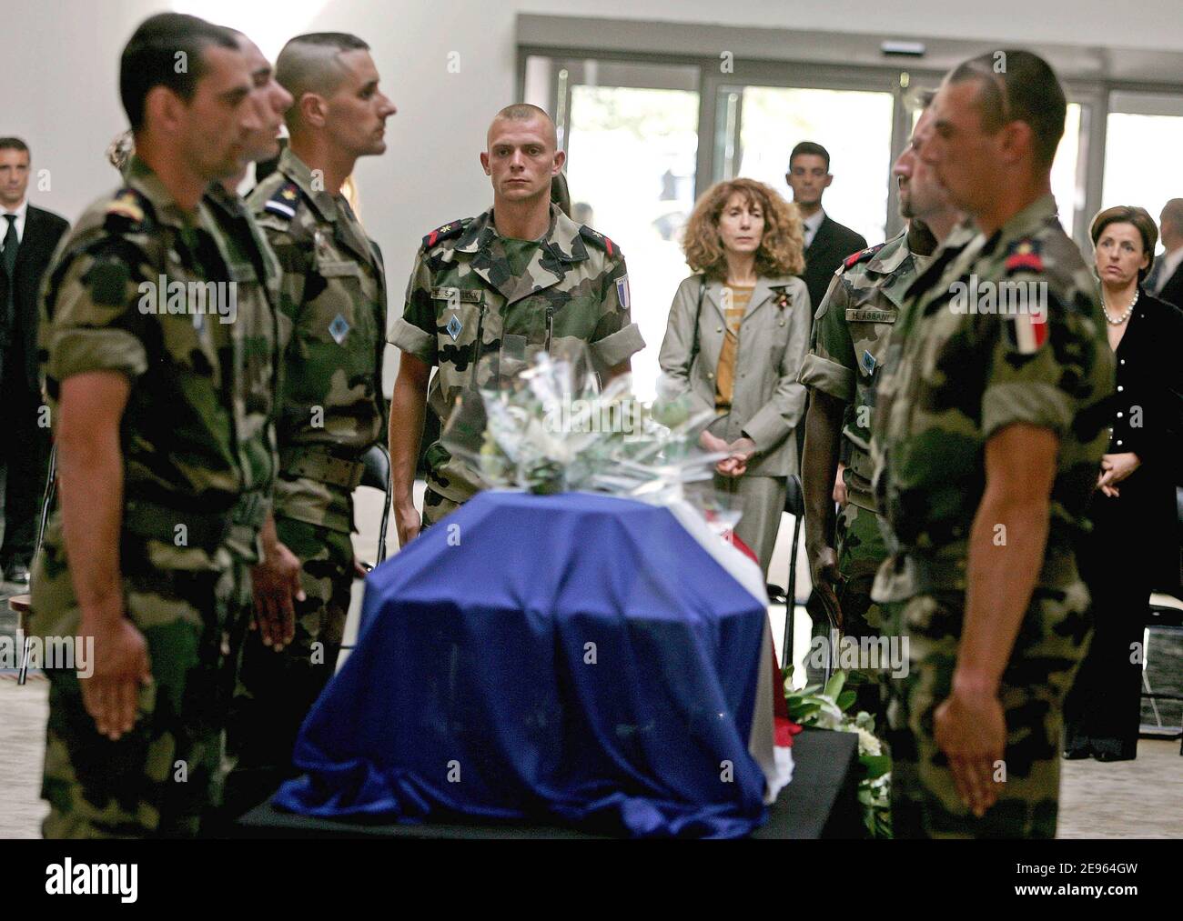 French soldiers salute beofre the coffin carrying the remains of Frenchman Michel Seurat as his widow Marie Seurat looks on, in Beirut, March 7, 2006. The body of Seurat, who was kidnapped more than 20 years ago in south Beirut, was found last October in the Lebanese capital, identified by DNA analysis, and on Tuesday sent back to France aboard a French presidential plane. Seurat, a researcher kidnapped on May 22, 1985, was announced as dead a year later in a statement from the militant group Islamic Jihad, which said the group had executed him. Photo by Michael Dohrn/ABACAPRESS.COM Stock Photo