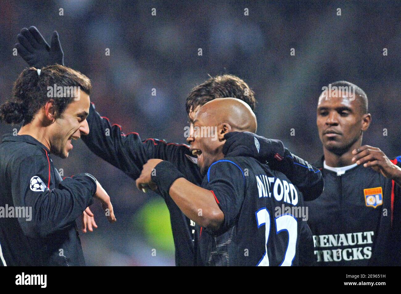 Olympic Lyonnais' Sylvain Wiltord celebrates his goal with team mate Juninho and Fred during the UEFA Champions league match, OLympic Lyonnais vs PSV Eindhoven at stade Gerland in Lyon, France on March 8, 2006. Olympic Lyonnais won 4-0. Photo by Stephane Kempinaire/Cameleon/ABACAPRESS.COM Stock Photo