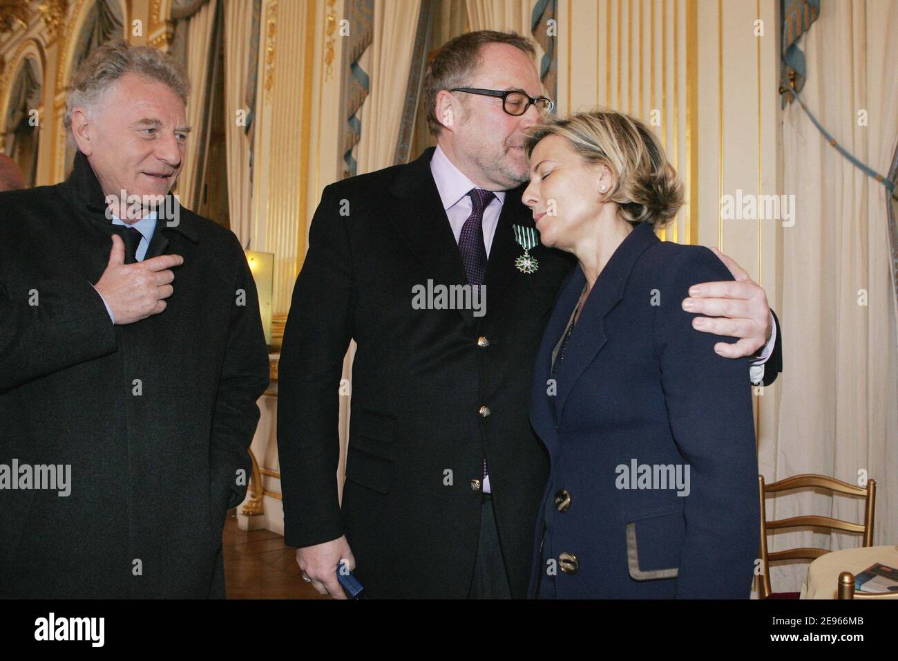 French PR Dominique Segall (c) poses with Claire Chazal and Robert Namias after receiving the 'Chevalier dans l'ordre des Arts et Lettres' medal from French culture minister Renaud Donnedieu de Vabres during a ceremony held at the ministry in Paris, France on March 17, 2006. Photo by Thierry Orban/ABACAPRESS.COM Stock Photo