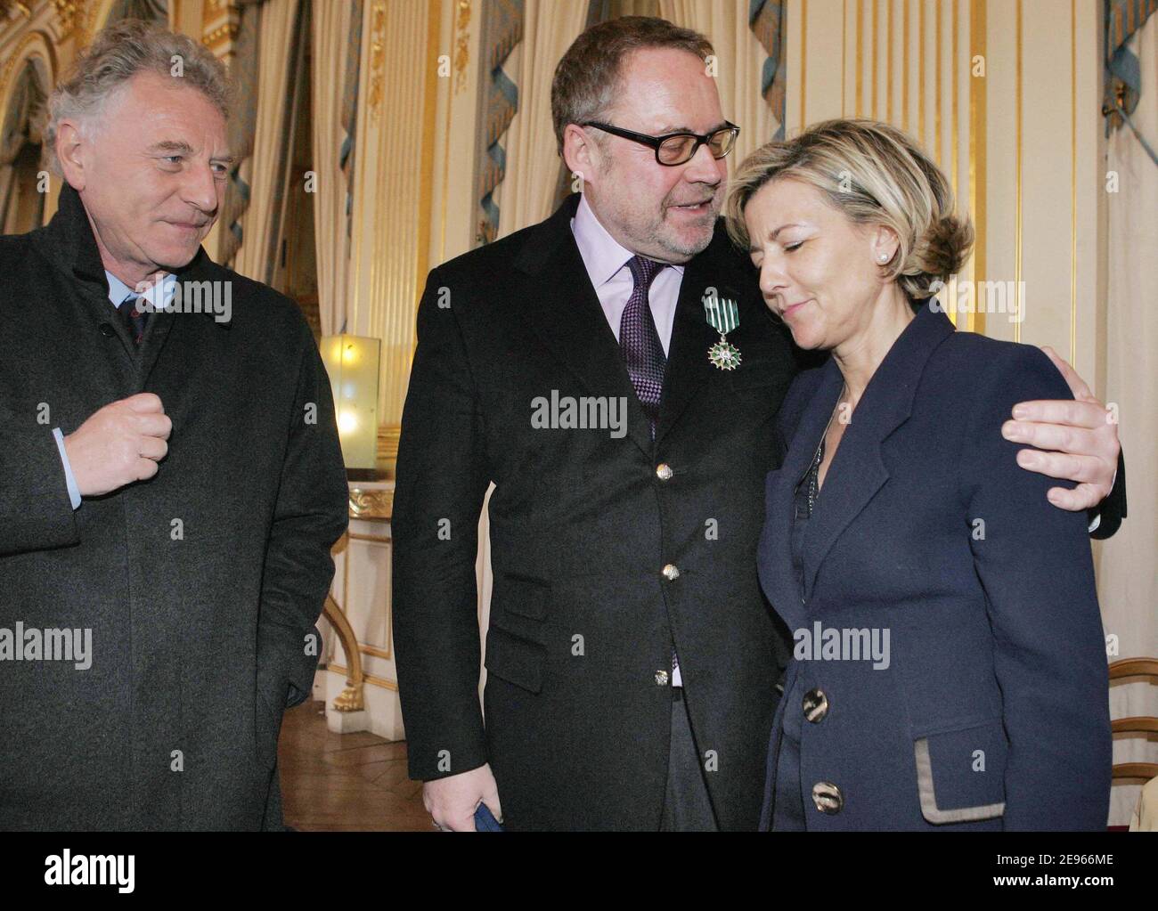 French PR Dominique Segall (c) poses with Claire Chazal and Robert Namias after receiving the 'Chevalier dans l'ordre des Arts et Lettres' medal from French culture minister Renaud Donnedieu de Vabres during a ceremony held at the ministry in Paris, France on March 17, 2006. Photo by Thierry Orban/ABACAPRESS.COM Stock Photo