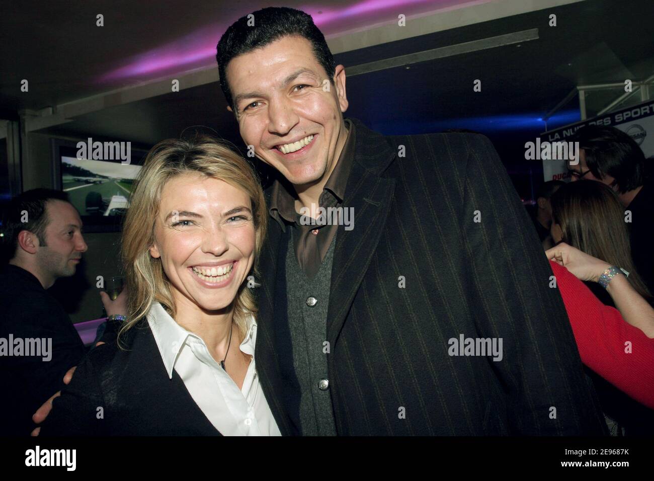 TF1 TV Presenter Nathalie Vincent with former rugbyman Abdelatif Benazzi attend the TF1 party 'La nuit des sports' at the Club l'Etoile in Paris, France, on March 21, 2006. Photo by Benoit Pinguet/ABACAPRESS.COM. Stock Photo