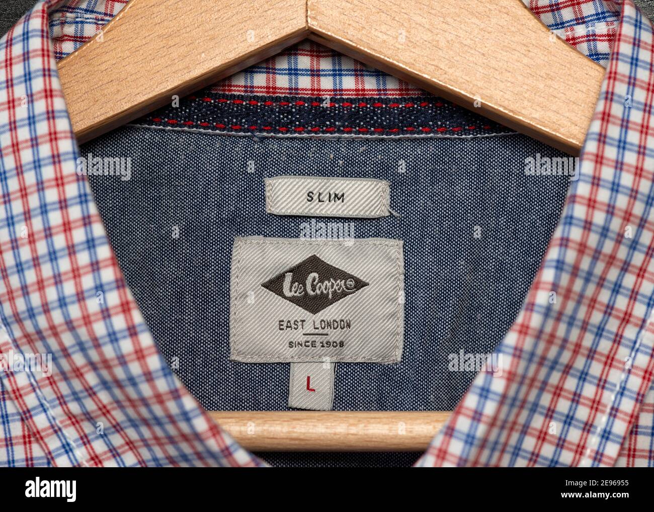 Lee Cooper East London slim fit label on men's shirt hanging on wooden  hanger Stock Photo - Alamy