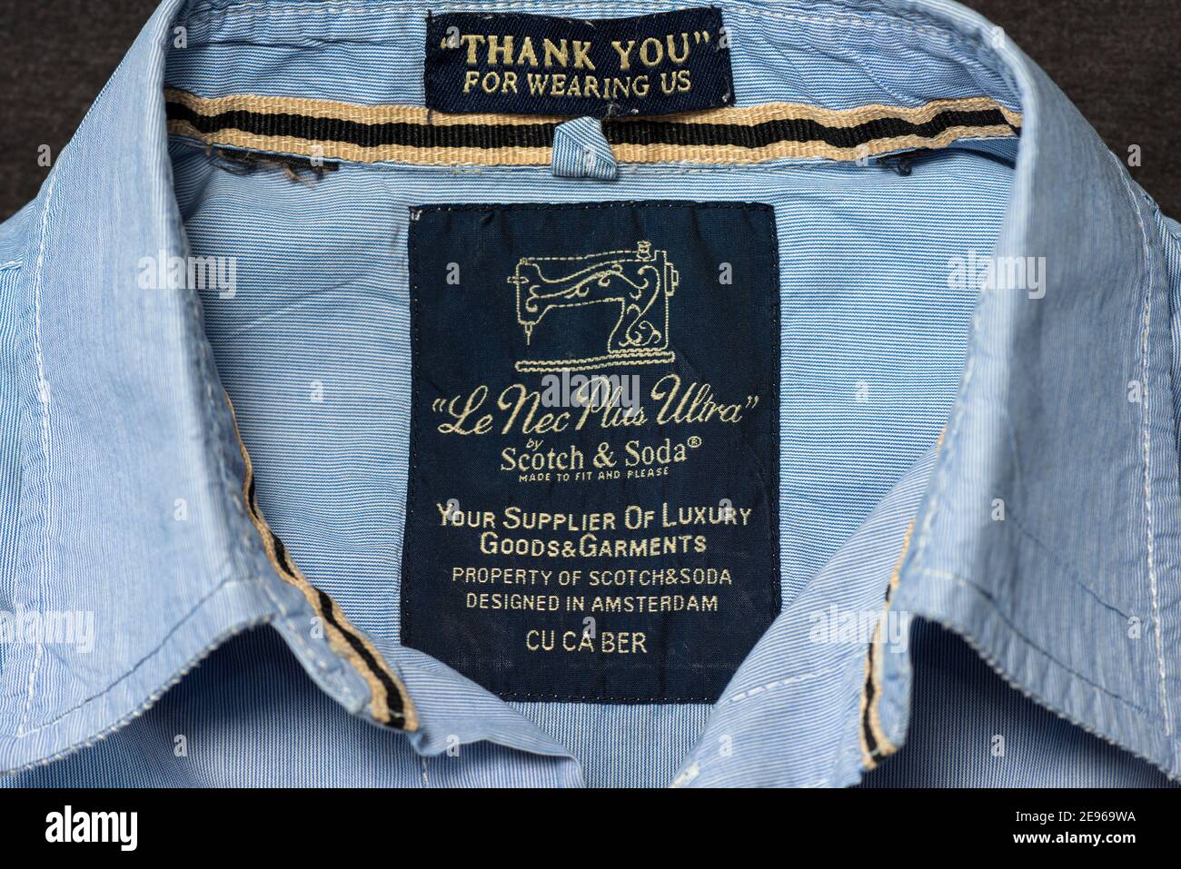 Le Nec Plus Ultra" by Scotch & Soda menswear vintage clothing label with  slogan and motto on blue shirt Stock Photo - Alamy