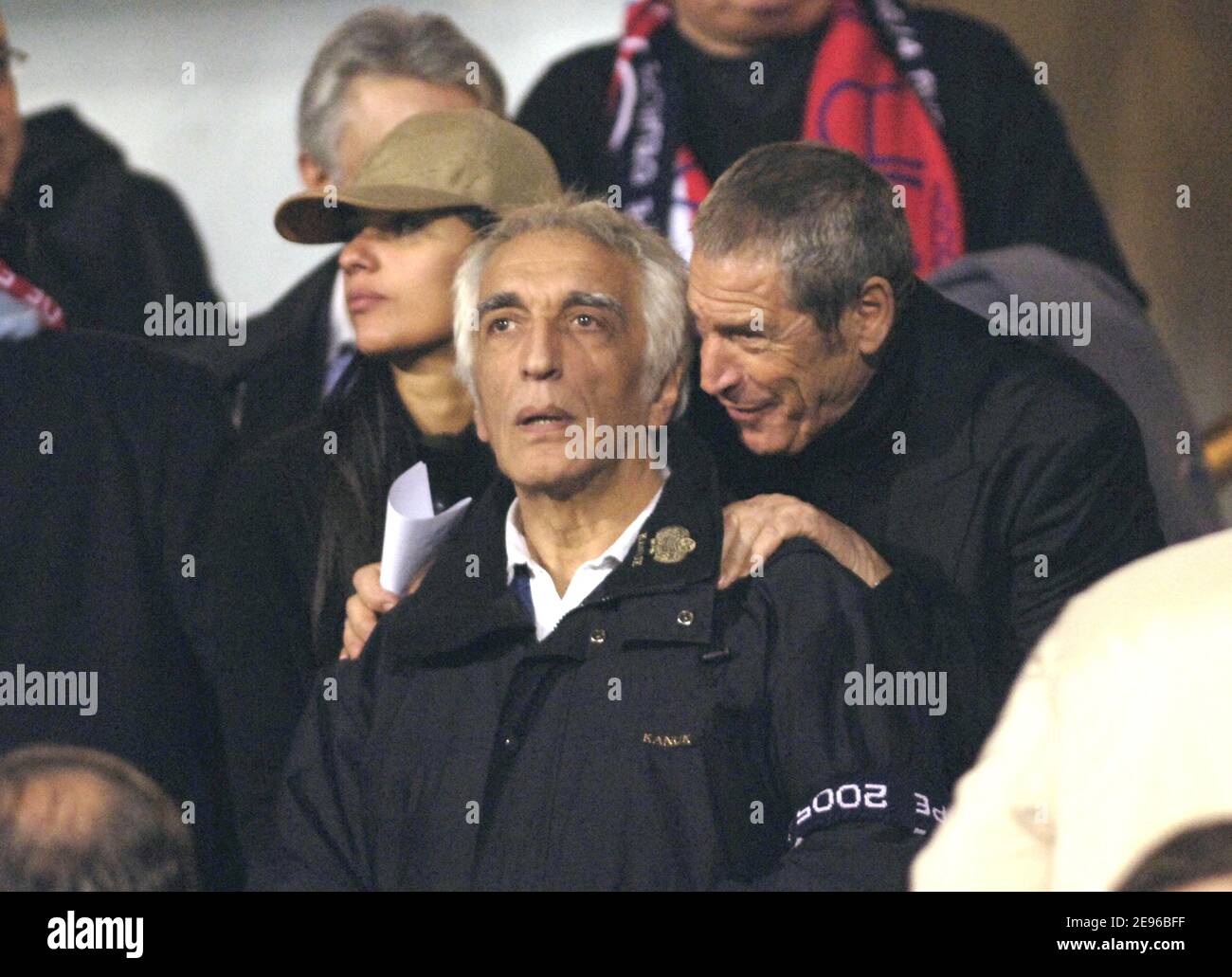 French actor Gerard Darmon and Sport's business manager Jean-Claude Darmond during the quarter finale first heat at the UEFA Champions league match, Olympic Lyonnais vs AC Milan, in Lyon, France, on March 29, 2006. The game ended in a drew 0-0. Photo by Nicolas Gouhier/Cameleon/ABACAPRESS.COM Stock Photo