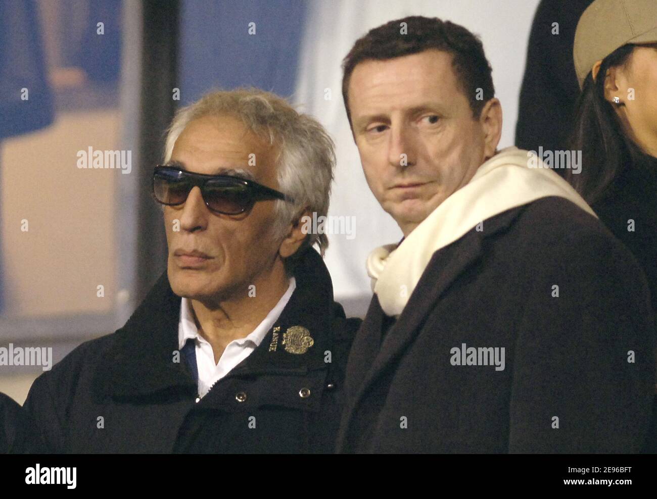 Actor Gerard Darmon and Pierre Botton during the quarter finale first heat at the UEFA Champions league match, Olympic Lyonnais vs AC Milan, in Lyon, France, on March 29, 2006. The game ended in a drew 0-0. Photo by Nicolas Gouhier/Cameleon/ABACAPRESS.COM Stock Photo