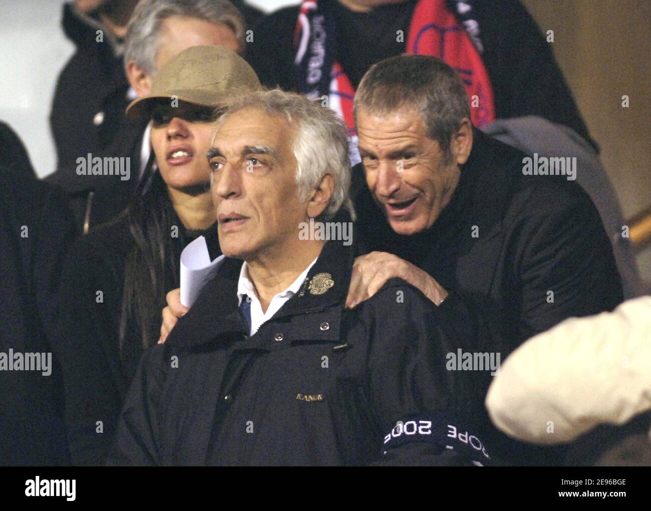 French actor Gerard Darmon and Sport's business manager Jean-Claude Darmond during the quarter finale first heat at the UEFA Champions league match, Olympic Lyonnais vs AC Milan, in Lyon, France, on March 29, 2006. The game ended in a drew 0-0. Photo by Nicolas Gouhier/Cameleon/ABACAPRESS.COM Stock Photo