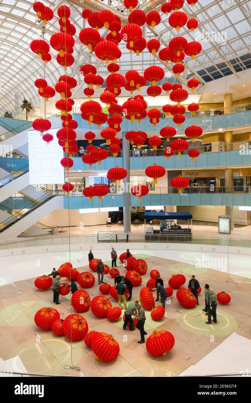 Dallas, USA. 2nd Feb, 2021. Staff members install red lanterns in Galleria Dallas shopping mall in Dallas, Texas, the United States, on Feb. 2, 2021. Over 200 red lanterns, as decorations for the upcoming Chinese Lunar New Year, are hung above the shopping mall's ice skating rink from Feb. 2 to March 2. Credit: Dan Tian/Xinhua/Alamy Live News Stock Photo
