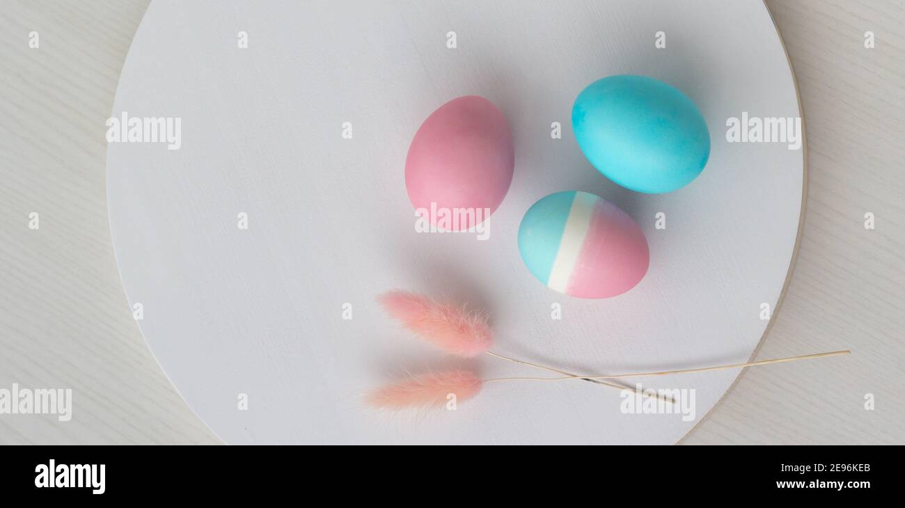 Delicate colors of Easter eggs on a white table Stock Photo