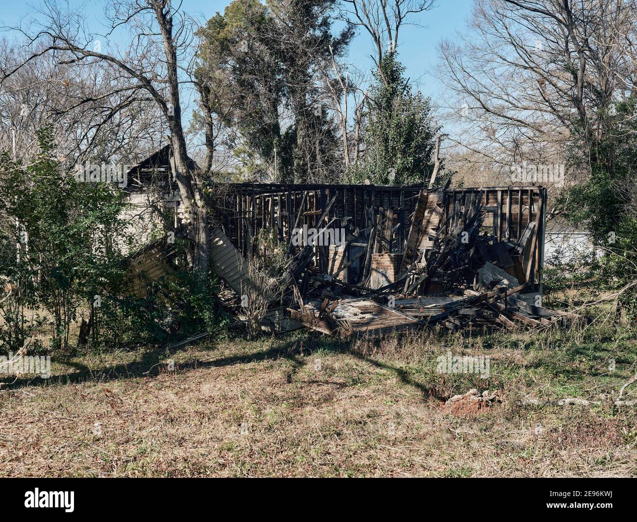 Burned out or burned down house or home or building in a poor neighborhood in Montgomery Alabama, USA. Stock Photo