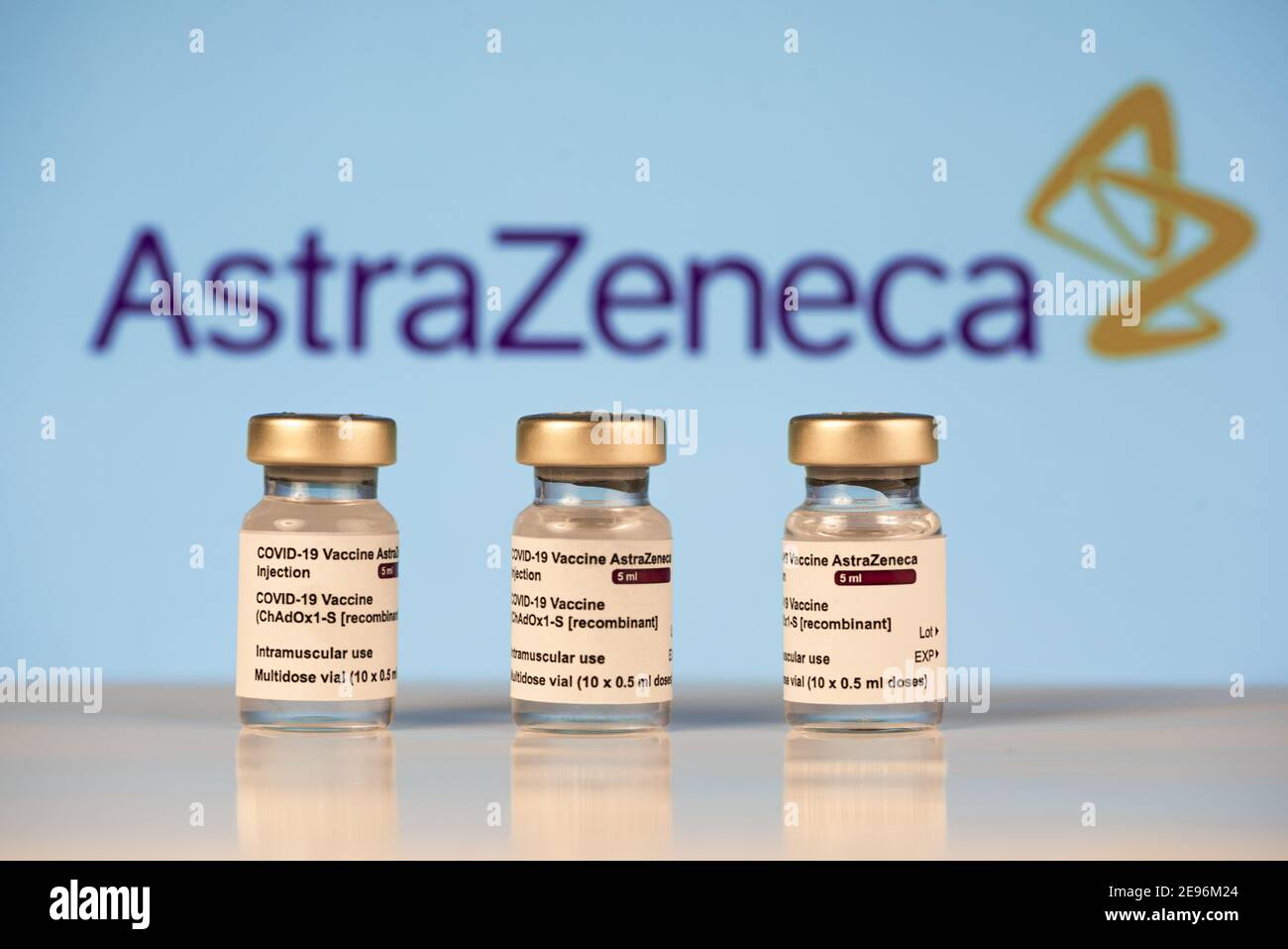 Three Covid-19 vaccine vials with white background and a syringe to ...
