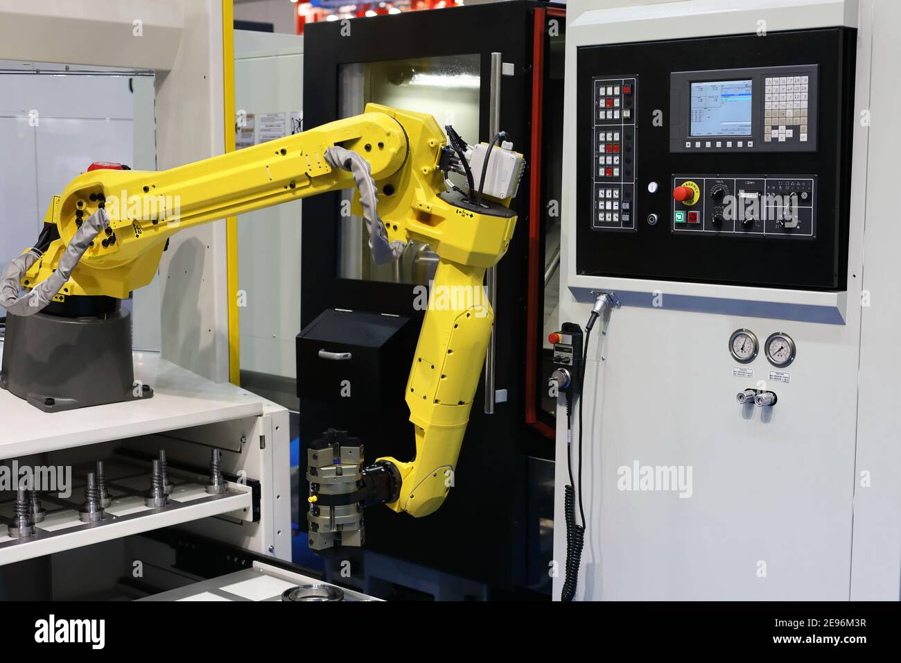 CNC machining center with automatic loading system. Selective focus. Stock Photo