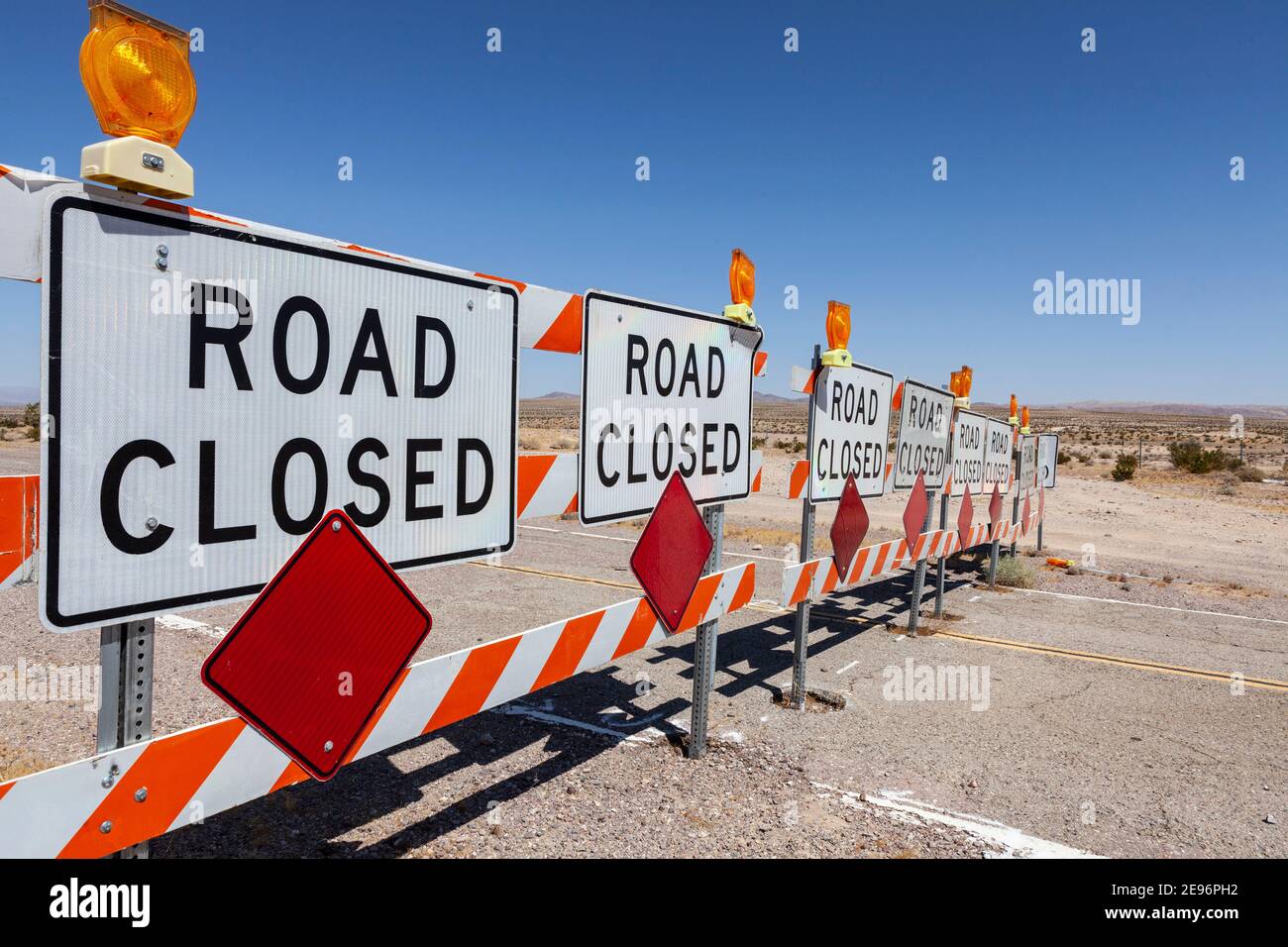 Desert highway road closed signs and barricades near Route 66 in the Southern California. Stock Photo