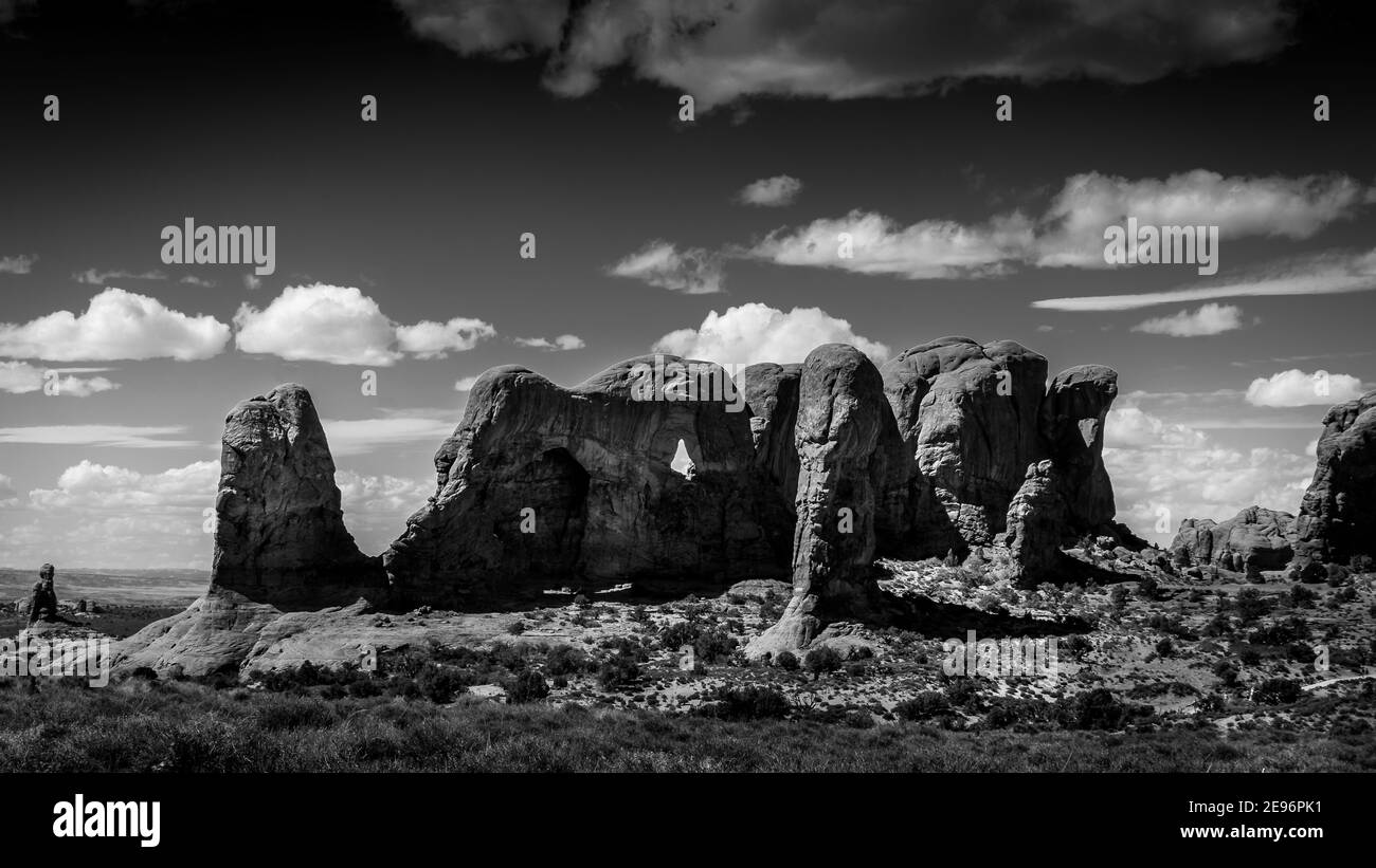 Black and White Photo of the Unique Red Sandstone Formations of the Parade of Elephants in Arches National Park near the town of Moab in Utah, USA Stock Photo
