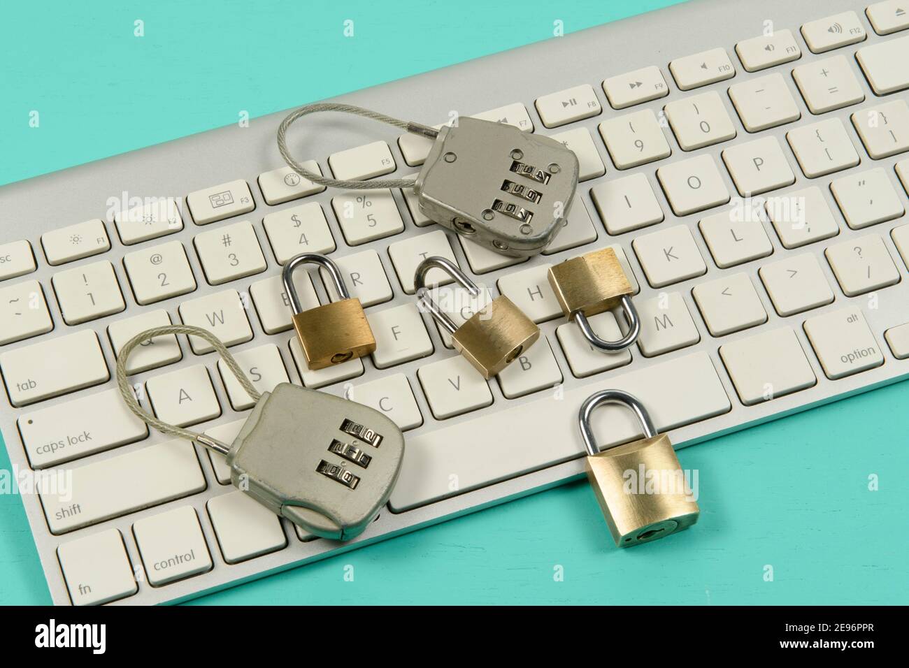 padlocks over a computer keyboard symbolizing data protection on the internet Stock Photo