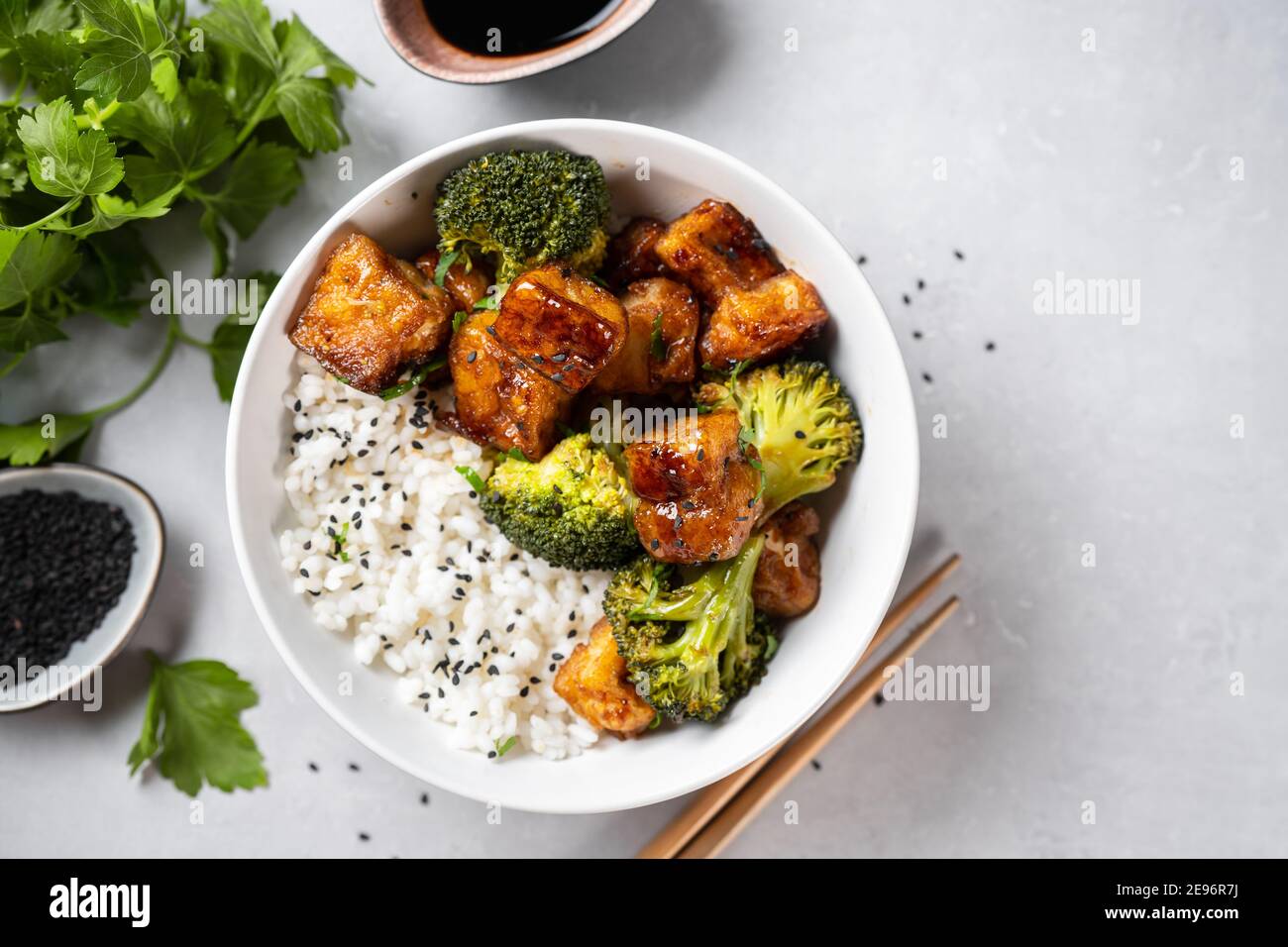 Healthy tofu bowl with broccoli and rice on white Stock Photo Alamy