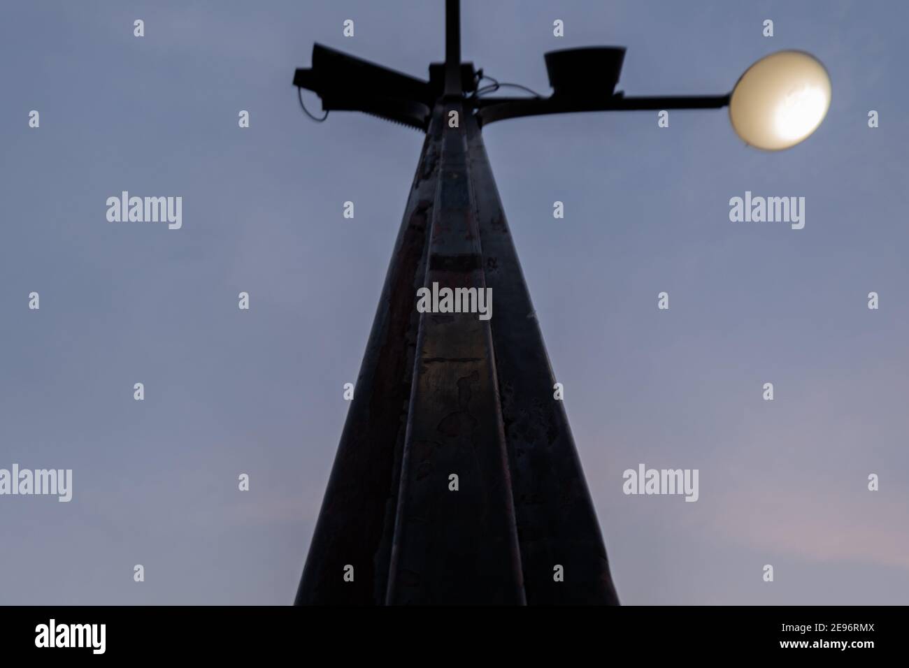 Low angle view of black lamppost under dark blue sky Stock Photo