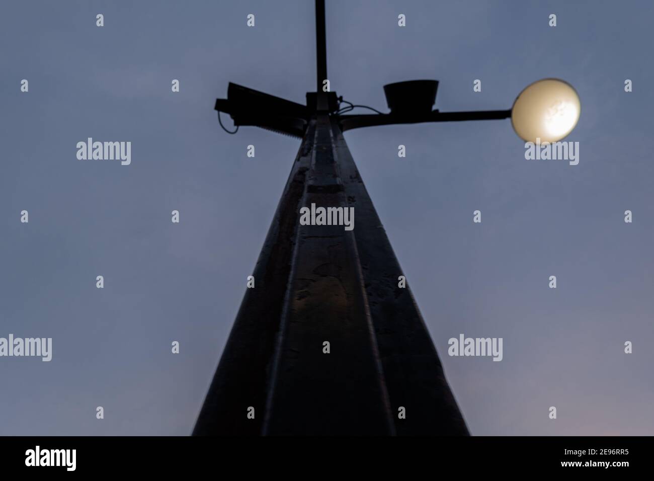 Low angle view of black lamppost under dark blue sky Stock Photo