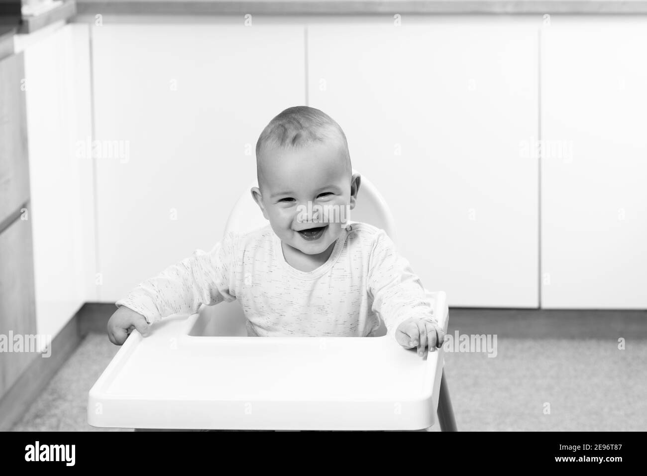 Portrait of Adorable Infant Baby Boy Sitting on the Chair Stock Photo