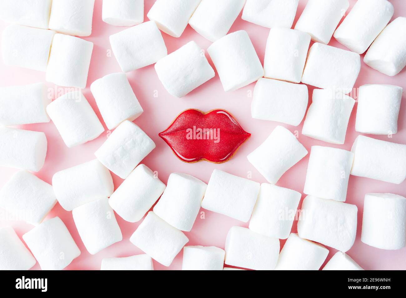 Gingerbread cookies lips with white marshmallow. Valentine card. Pink background Stock Photo