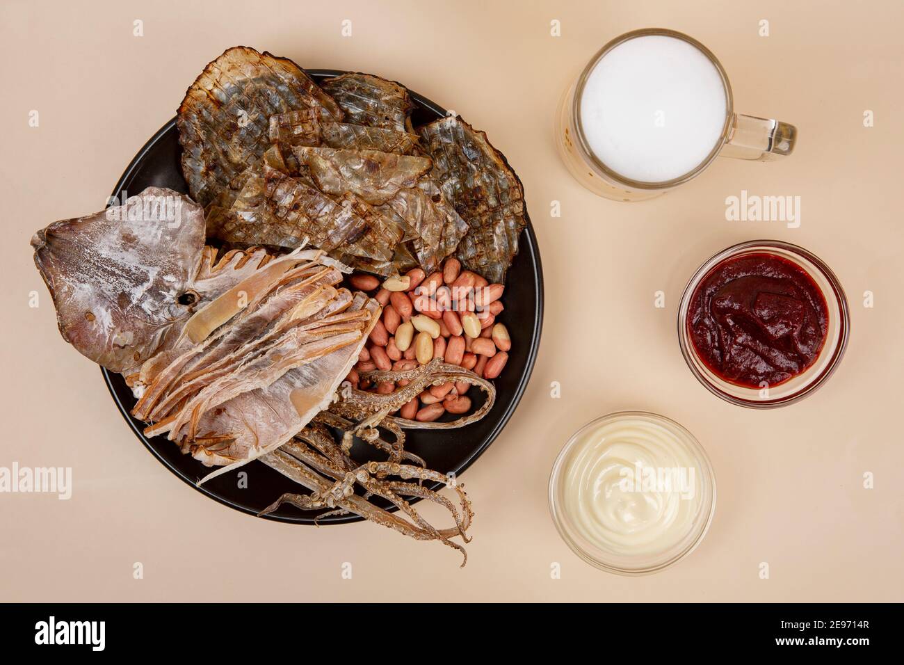 dried squid, filefish and beer Stock Photo Alamy