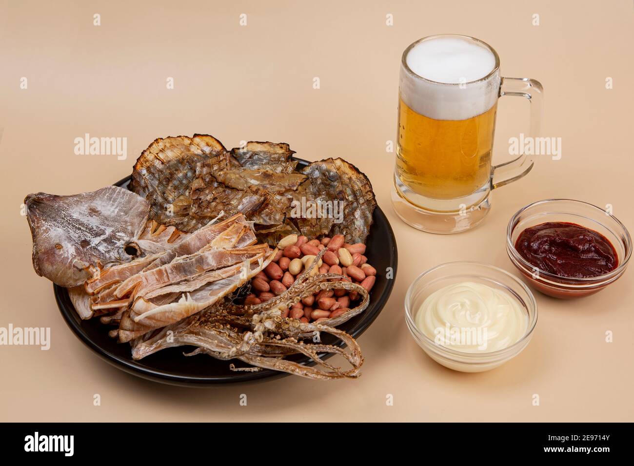 dried squid, filefish and beer Stock Photo Alamy