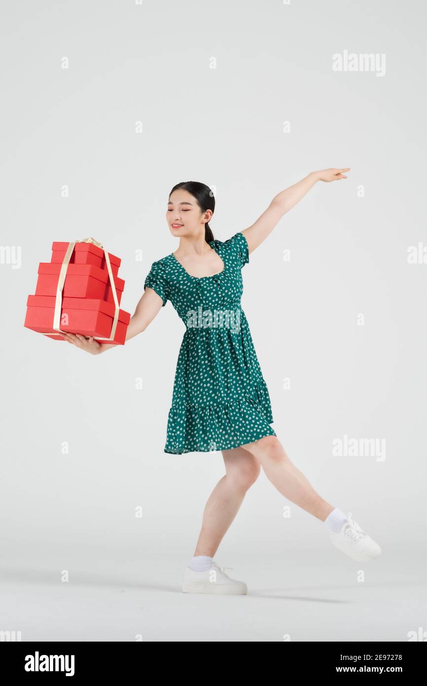 Sale Promotion Concept, Contemporary Female Dancer With Shopping Gift Box  Stock Photo - Alamy