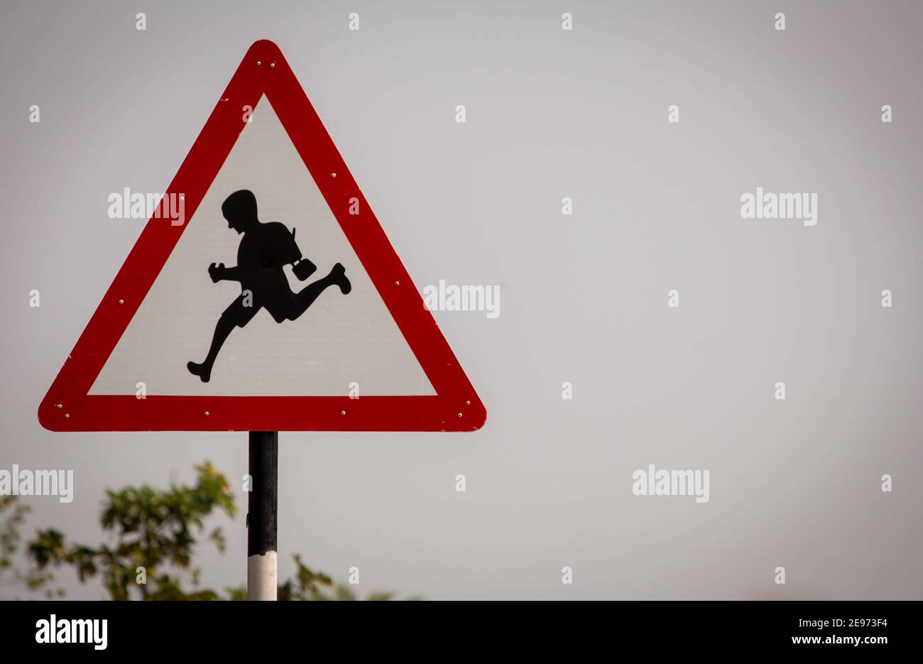 Indian road cautionary sign indicating school ahead. Sign indicating