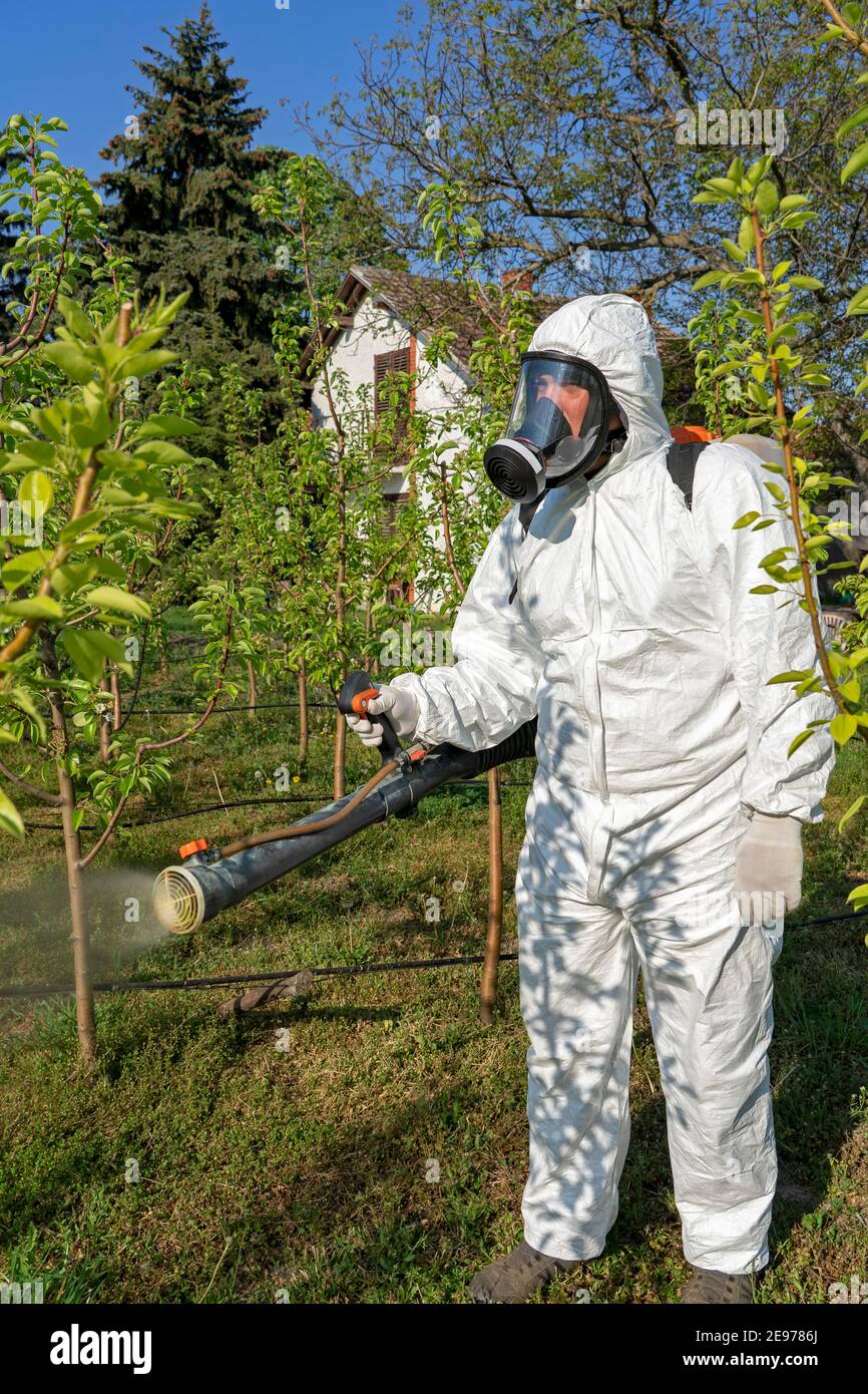 Protective farmer pesticide clothing hires stock photography and
