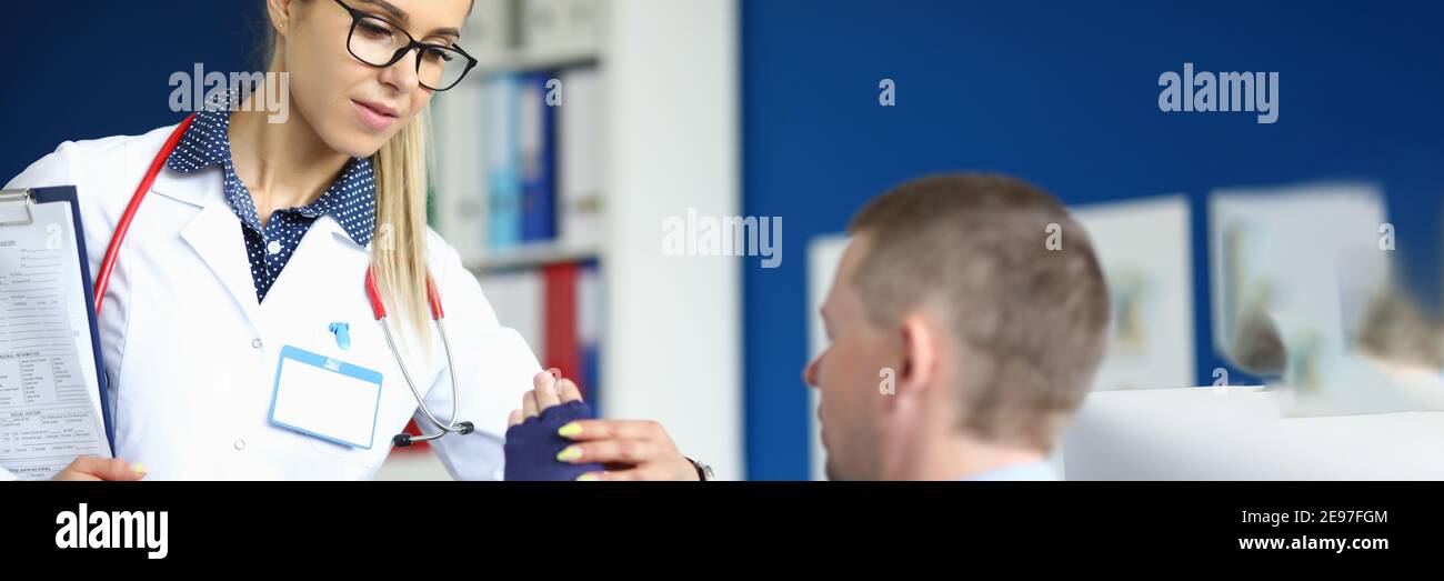 Concentrated blonde nurse with paper Stock Photo