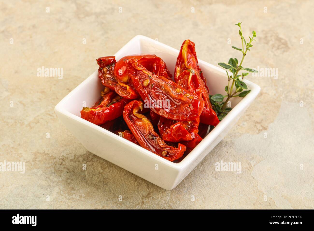 Sundried tomato in olive oil with herbs and spices Stock Photo Alamy
