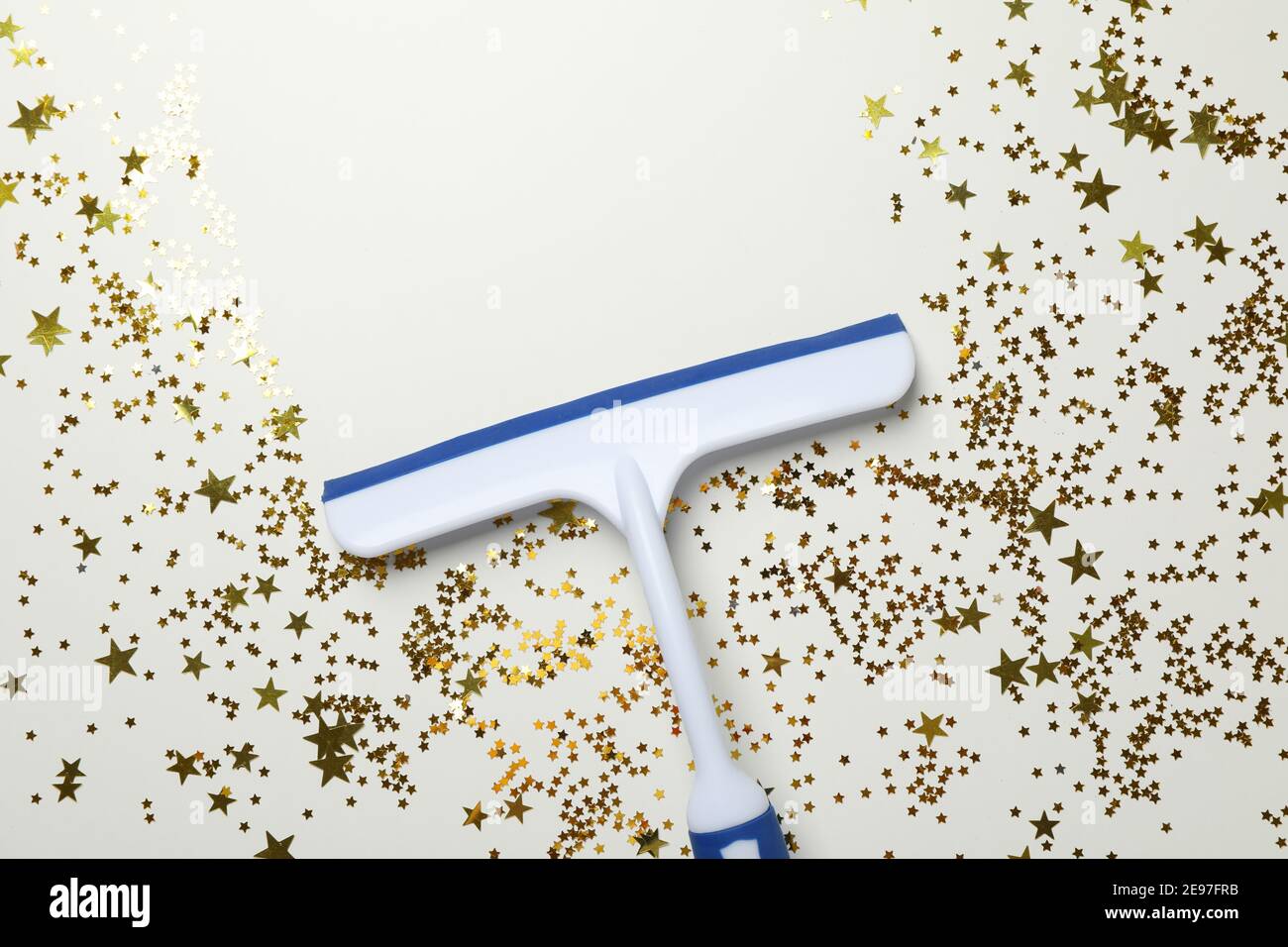 Window cleaning squeegee on white background with glitter Stock Photo