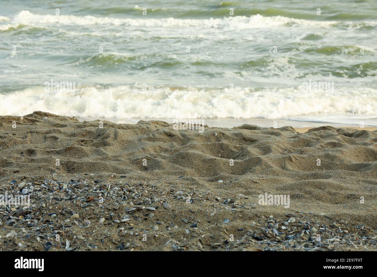 Sea with waves on beautiful sandy beach Stock Photo
