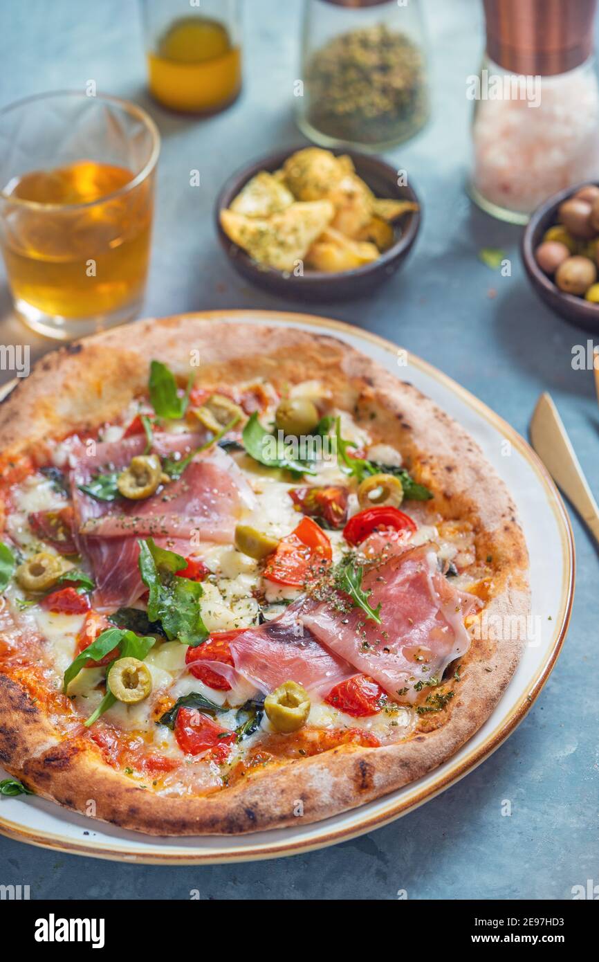 Pizza with ham and vegetables Stock Photo
