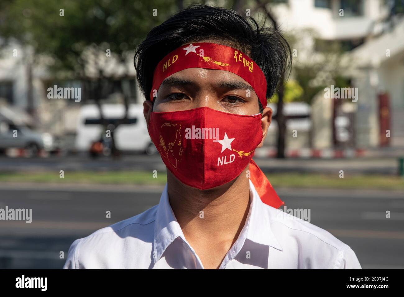 Thailand. 3rd Feb, 2021. A protestor wears a National League for Democracy mask and headband, during a protest of the Myanmar Military coup outside of the United Nations ESCAP building in Bangkok, Thailand, on Wednesday, February 3, 2021, in Bangkok, Thailand. Credit: Andre Malerba/ZUMA Wire/Alamy Live News Stock Photo