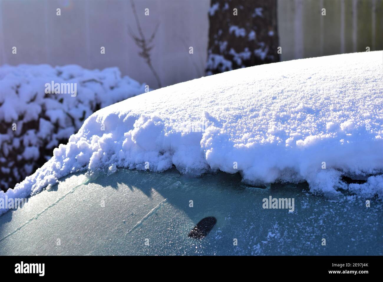Iced snow on a car roof in the sunlight as a close up Stock Photo Alamy